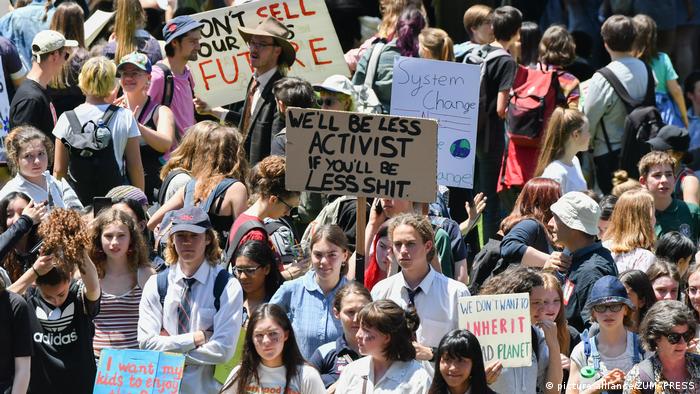 Students protest in Australia against Scott Morrison's handling of the bushfires, armed with placards criticizing his climate policy