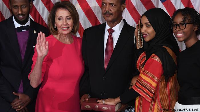 US congresswoman Ilhan Omar takes her oath on a Quran