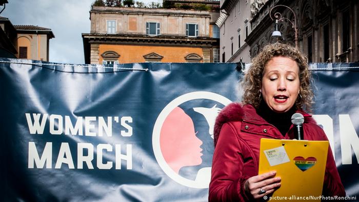 A demonstrator speaks at the Women's March in Rome