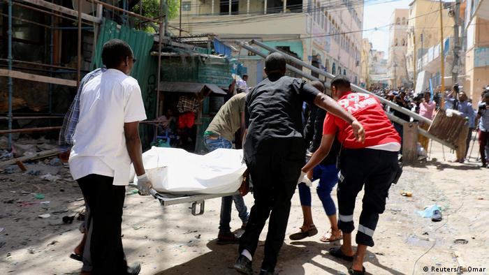 People carrying a stretcher in Mogadishu, Somalia (Reuters/F. Omar)