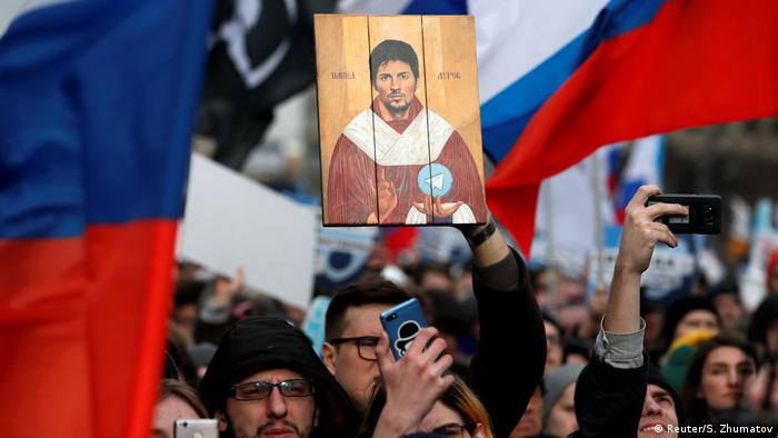 A man holds a picture of Pavel Durov, the founder of Telegram Messenger, during a rally to protest against tightening state control over internet (Reuter/S. Zhumatov)