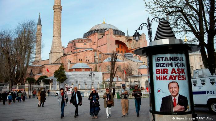 People walk past an Erdogan election poster outside Hagia Sophia (Getty Images/AFP/Y. Akgul)