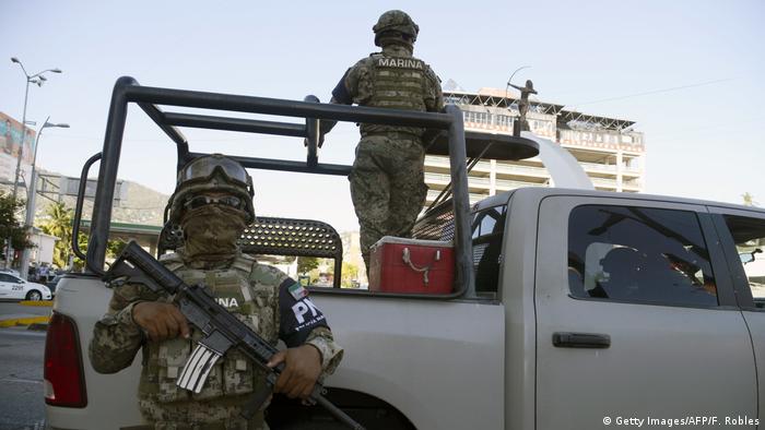 Two Mexican soldiers with a pickup truck patroling a street in Acapulco, in Guerrero state