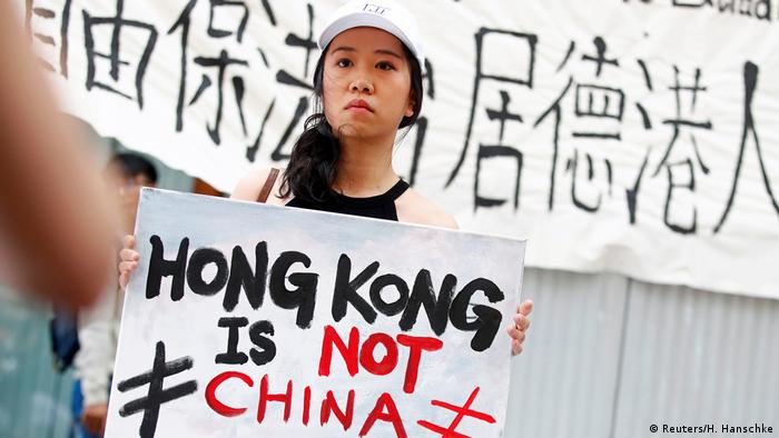 Protestor with a placard reading Hong Kong is not China