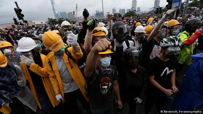 Protestors in helmets