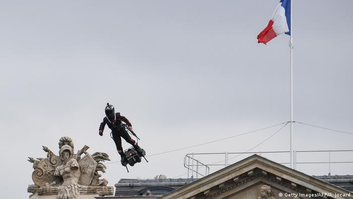 Frank Zapata hovers over Place de la Concorde during a French military parade