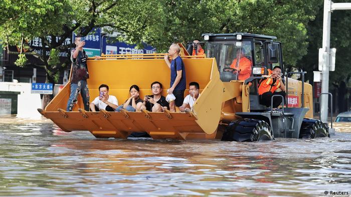 A bulldozer evacuating residents in China after typhoon Lekima