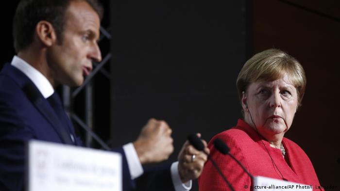 Эмманюэль Макрон и Ангела Меркель во время саммита большой семерки в Биаррице
