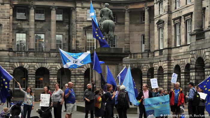 People at a rally in Edinburgh hold Scottish and EU flags (AFP/Getty Images/A. Buchanan)