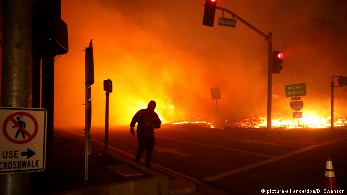 The wildfire burns near a freeway in San Fernando Valley on Friday 
