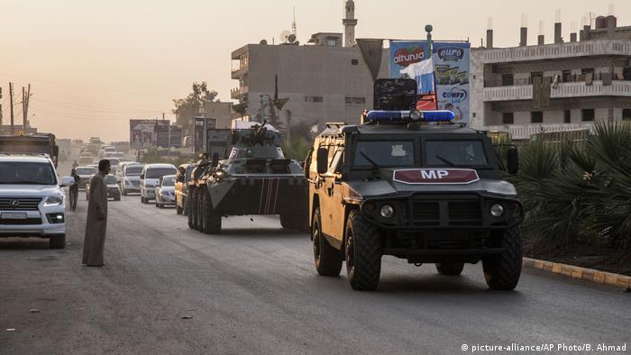 A Russia armoured 4x4 patrols in Syria