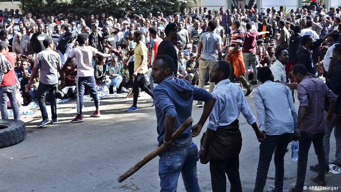 Protesters gather outside the home of activist and media owner Jawar Mohammed (AFP/Stringer)