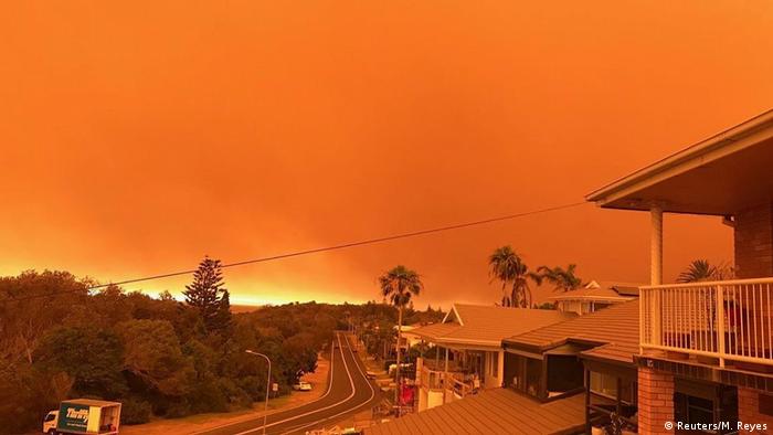 Bushfires turn the sky orange in Port Macquarie. 