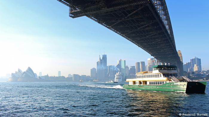 A ferry navigates smoke-filled Sydney