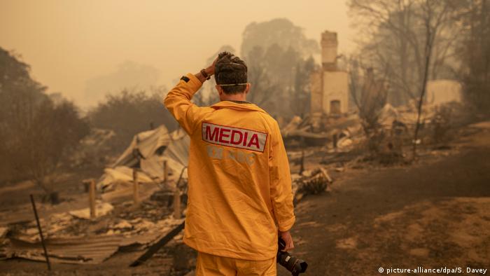 A press photographer in the fires