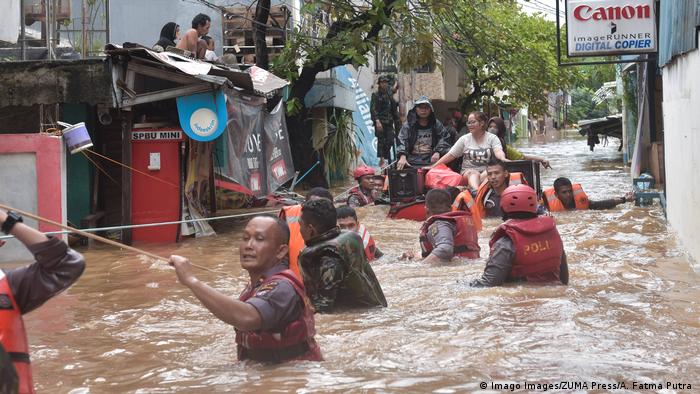 Rescue workers evacuating residents from flooding in Jakarta