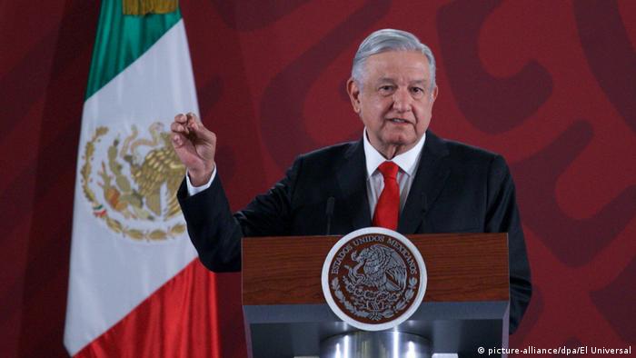 Mexico's president Lopez Obrador in front of a national flag during a news conference in the presidential palce