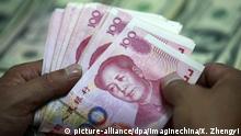 Symbolbild Dollar Yuan Währung Wechselkurs