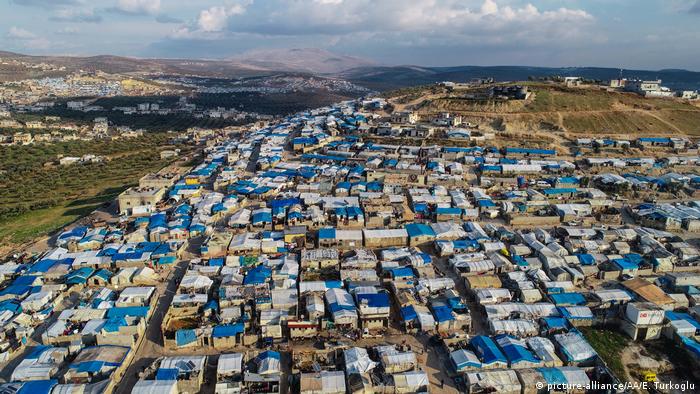 A drone photo shows tents at a camp hosting displaced Syrian families from Idlib. Erdal Turkoglu / Anadolu Agency. 