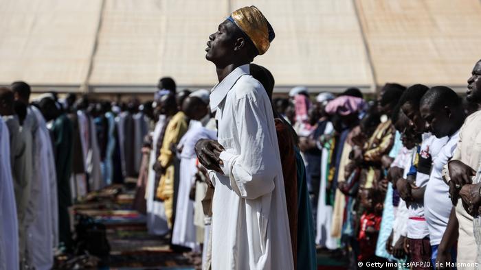 A Muslim man prays in Burkina Faso