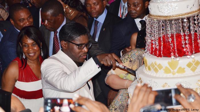 Teodorin Obiang cuts birthday cake with his mother and guests in the background (Getty Images/AFP/J. Leroy)