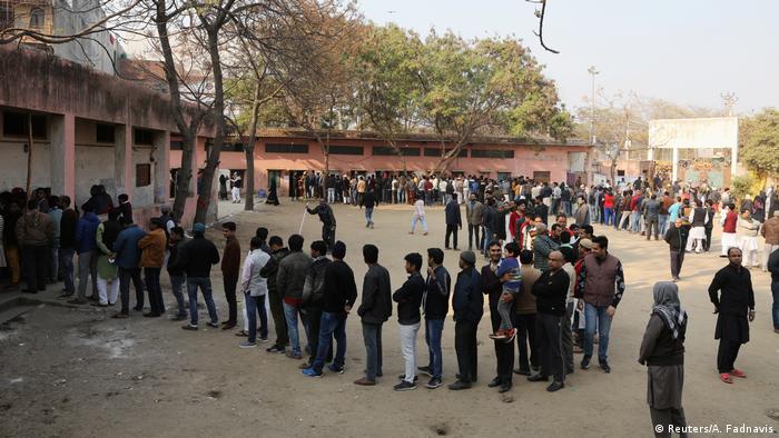 People line up to vote in state elections in New Delhi