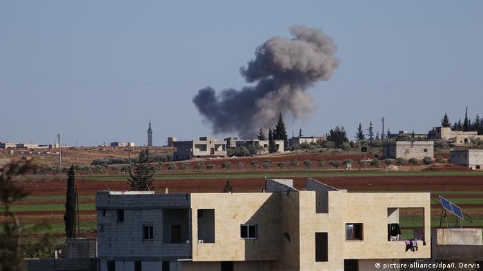 Smoke rises after Russian and Syrian regime forces carried out airstrikes in northwestern Syria