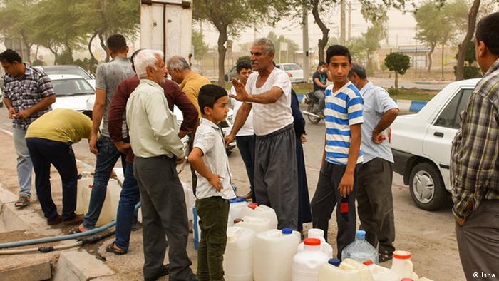 People waiting to fill up water containers