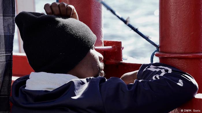 On board the Ocean Viking, a refugee looks out to sea. (DW/M. Soric)