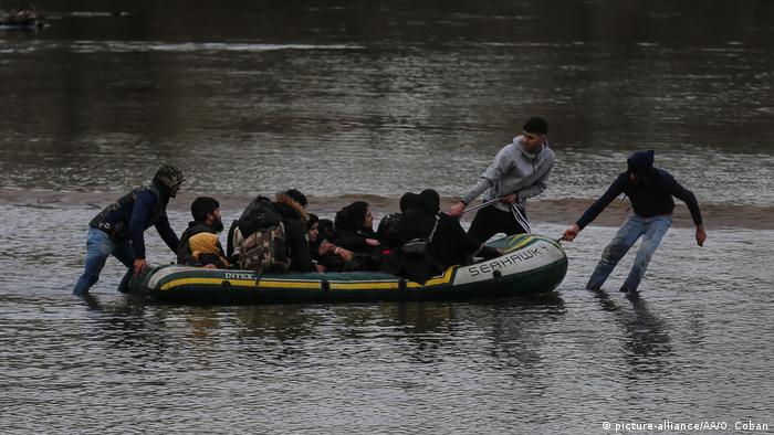 A Syrian family tries to cross the Evros River into Greece in late February 2020.