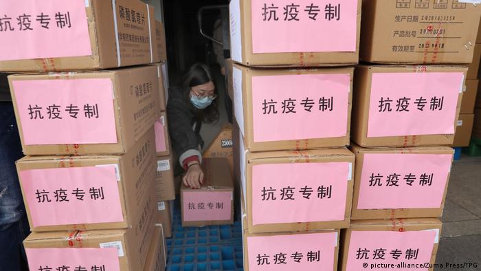 A woman sorts medical supplies in Nantong,Jiangsu,China