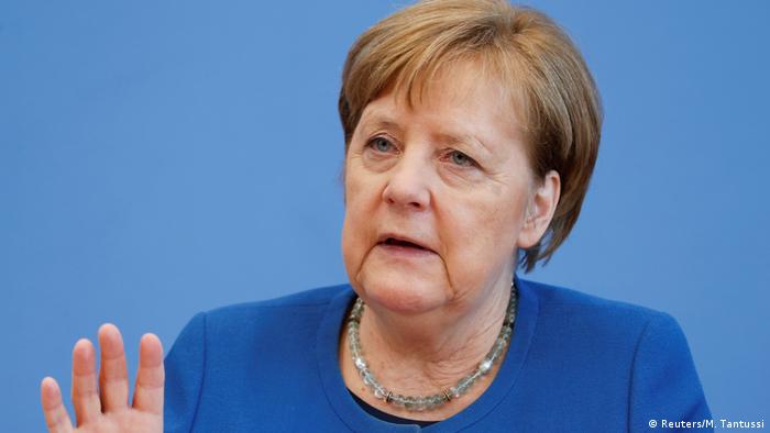 German Chancellor Merkel addresses a news conference on coronavirus in Berlin (Reuters/M. Tantussi)