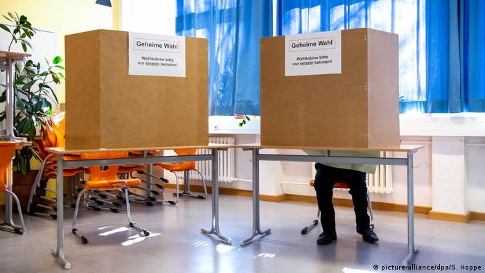 A voter casts their ballot in Bavaria