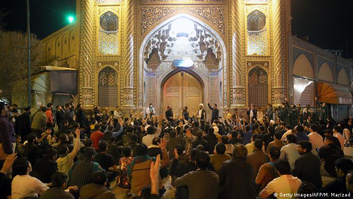 Angry demonstrators gathered in front of the two sanctuaries in Qom and tried to break through the gates leading to the shrines