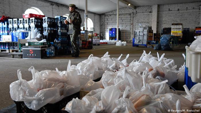 Soldiers of the German armed forces Bundeswehr prepare food supply for truck drivers