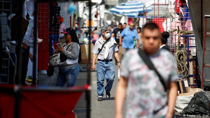 Some people wearing masks at Tepito market in Mexico City during coronavirus outbreak