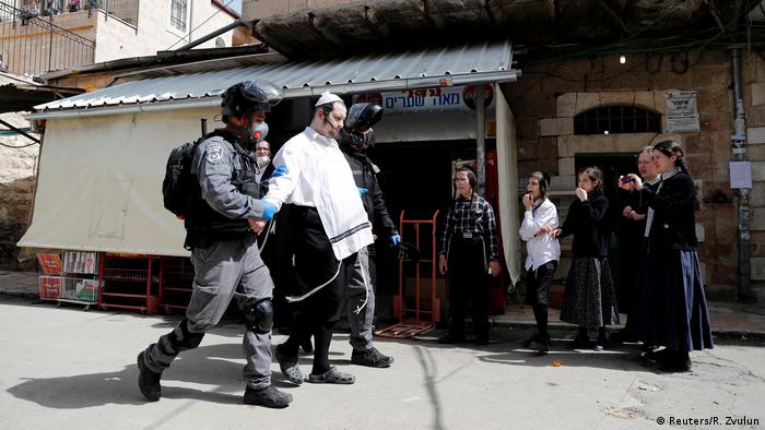 Police detaining an ultra-Orthodox man in Jerusalem, Israel (Reuters/R. Zvulun)