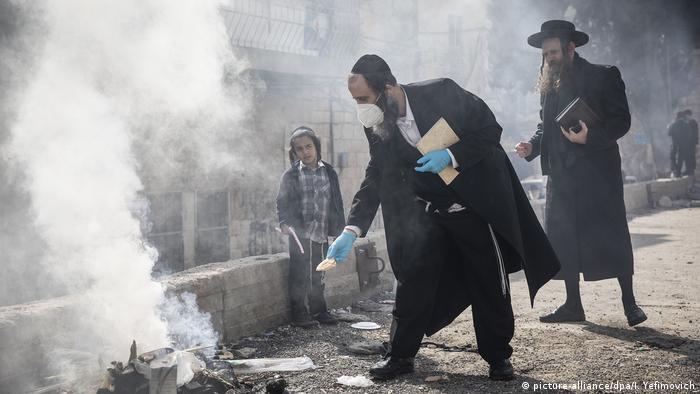 Jews in Jerusalem burning bread to mark the start of Passover