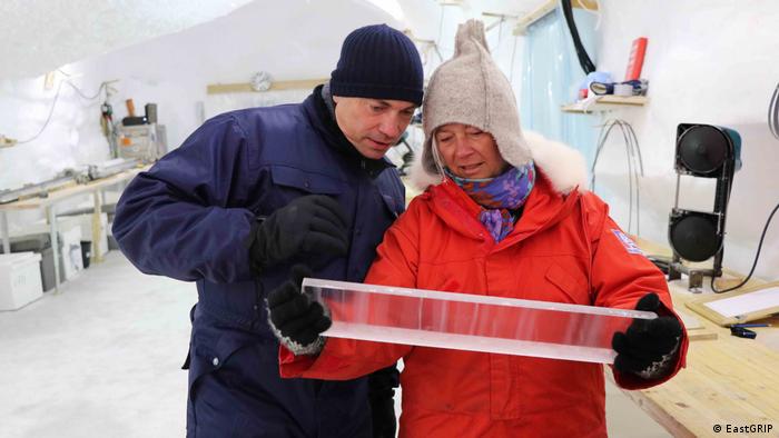 Professor Dorthe Dahl-Jensen examines a block of ice with former Danish Research Minister Tommy Ahler