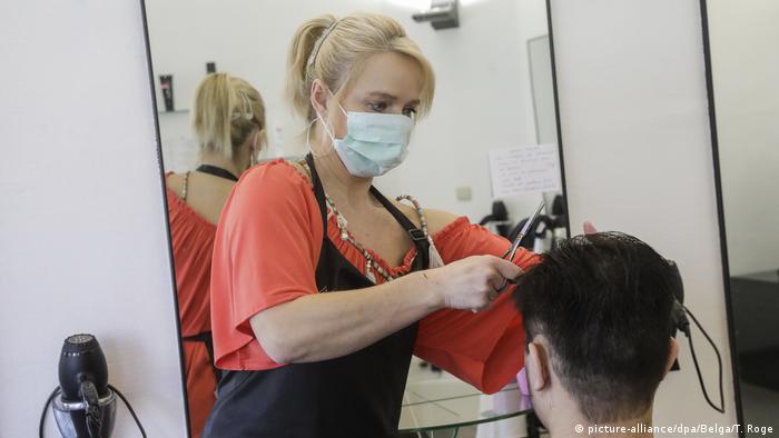 Hairdresser wearing a mask