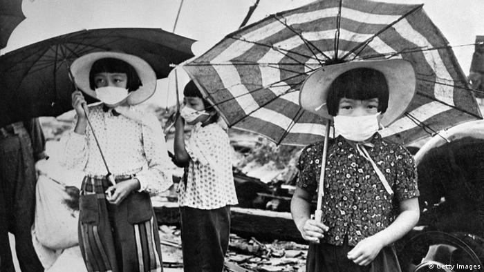 Picture from 1948 showing children wearing masks to protect themselves from irradiation in the devastated city of Hiroshima (Getty Images)