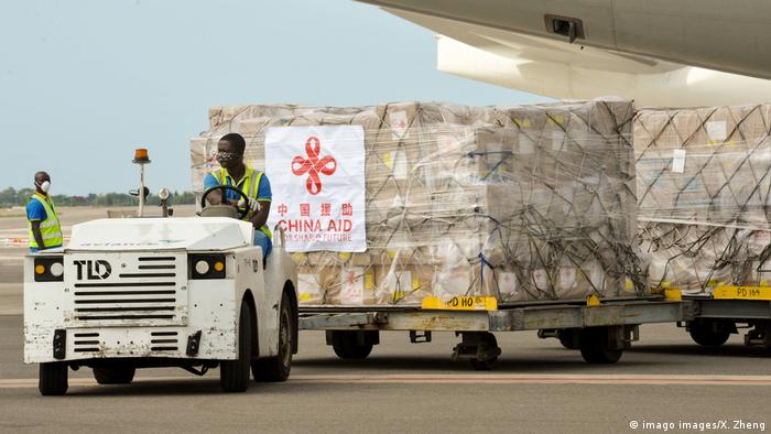 Boxes of medical supplies loaded onto a trailer are driven off the tarmac at Ghana's Kotota airport