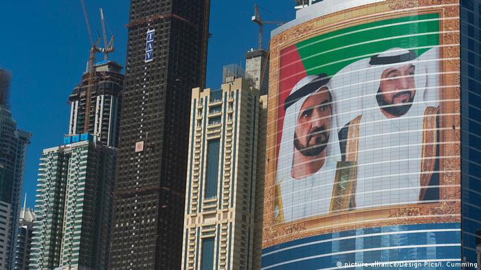 Portraits of UAE President Khalifa bin Zayed Al Nahyan and Dubai Sheikh Mohammed bin Rashid Al Maktoum on an office building