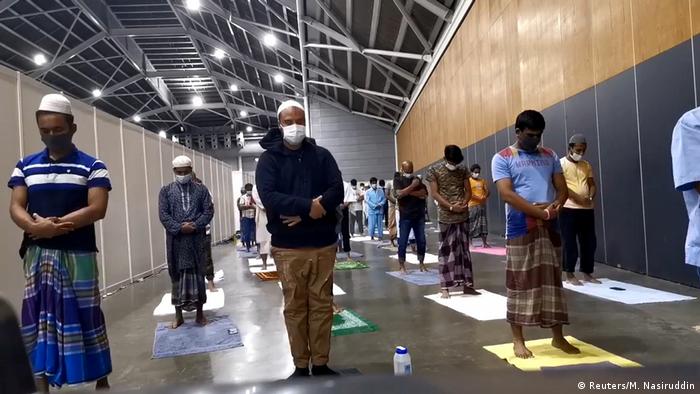 Muslim patients perform Ramadan prayers at the Singapore Expo Convention Hall and Exhibition Centre