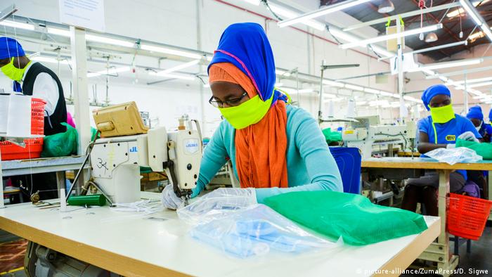 An employee at Shona EPZ Limited sewing face masks (SOPA Images/D. Sigwe)