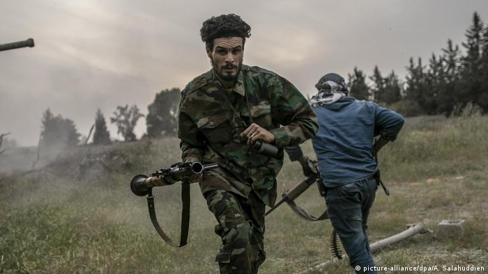Libyan GNA fighters run for cover