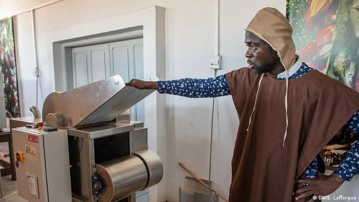 A man working at a chocolate manufacturing factory in Ivory Coast