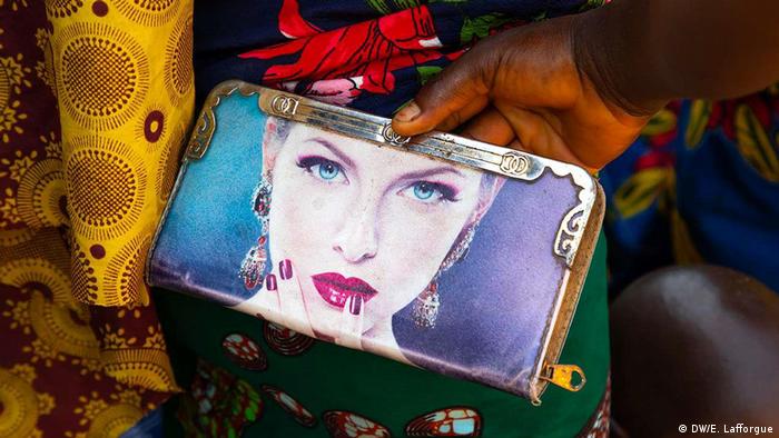 A purse sold at a market in the Ivory Coast depicting a woman with light skin