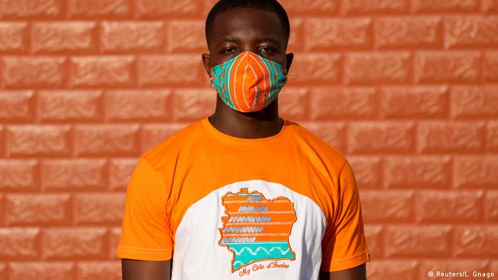 Designer Arthur Bella N'guessan wears a matching mask and T-shirt