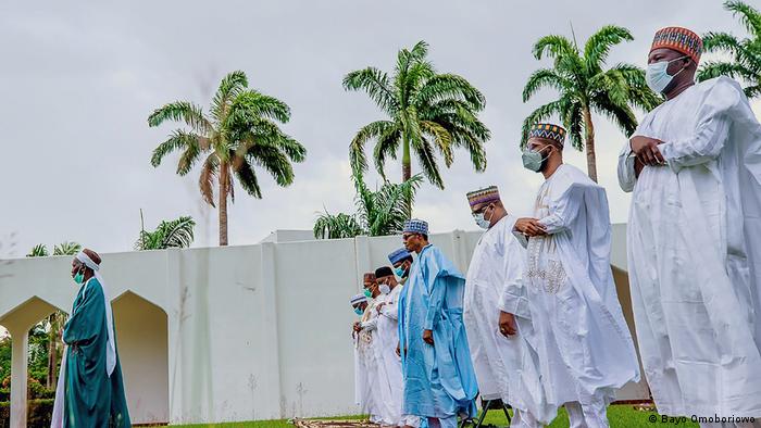 Buhari and his family observing Eid prayers at his villa (Bayo Omoboriowo)